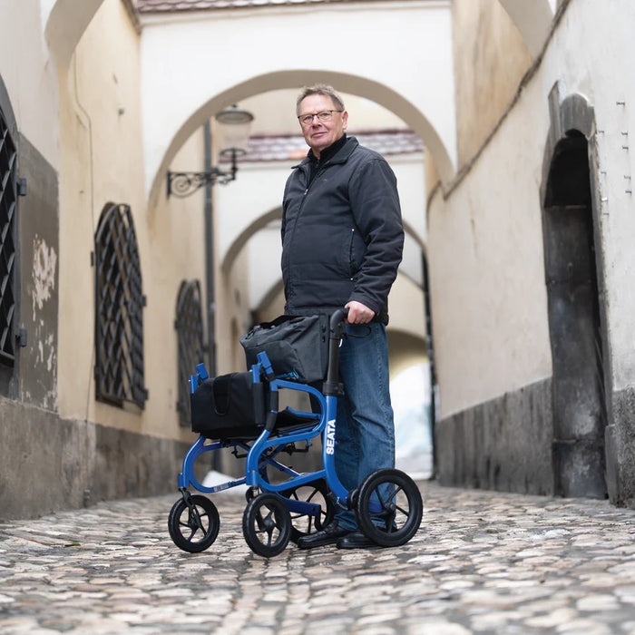 Strongback Mobility Seata Rollator Lightweight, Comfortable, and Ergonomic Sample Picture with a Man using the Rollator