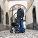 Strongback Mobility Seata Rollator Lightweight, Comfortable, and Ergonomic Sample Picture with a Man using the Rollator