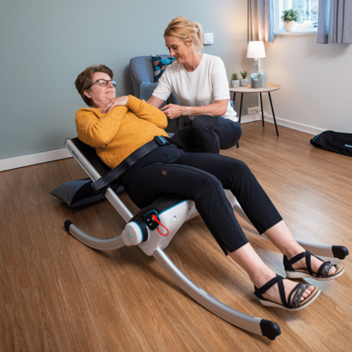Savaria Raizer II Mobile Patient Lift Chair For Safe Fall Recovery And Caregiver Assistance Featuring Patient In Use With Help Of Caregiver 