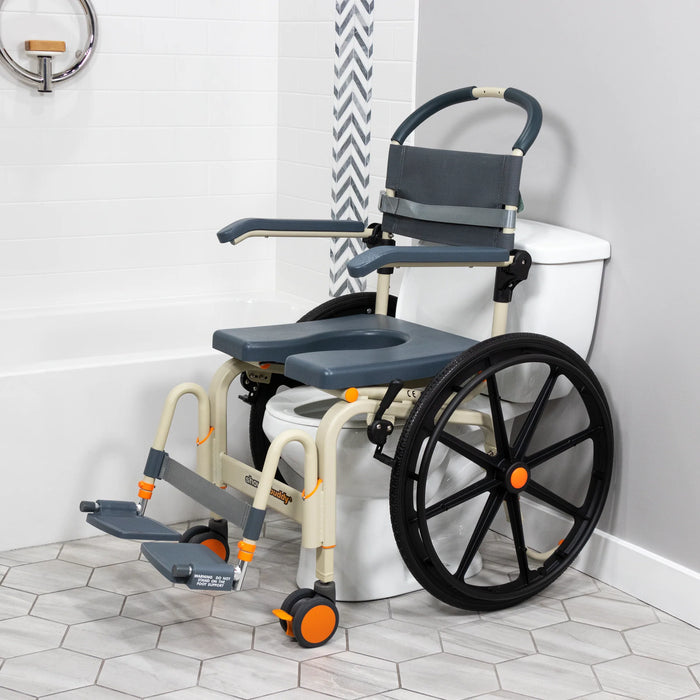 Reliable Solution Based Self-Propelled Roll-In Shower Chair Lightweight, Height Adjustable, Over-Toilet and Bedside Commode with 24” Wheels and Safety Feature