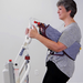 Span America Powered Sit-to-Stand Patient Lift For Home And Medical Use With Up To 500 Lb Capacity In Long Term Care Setting With Patient In Lift