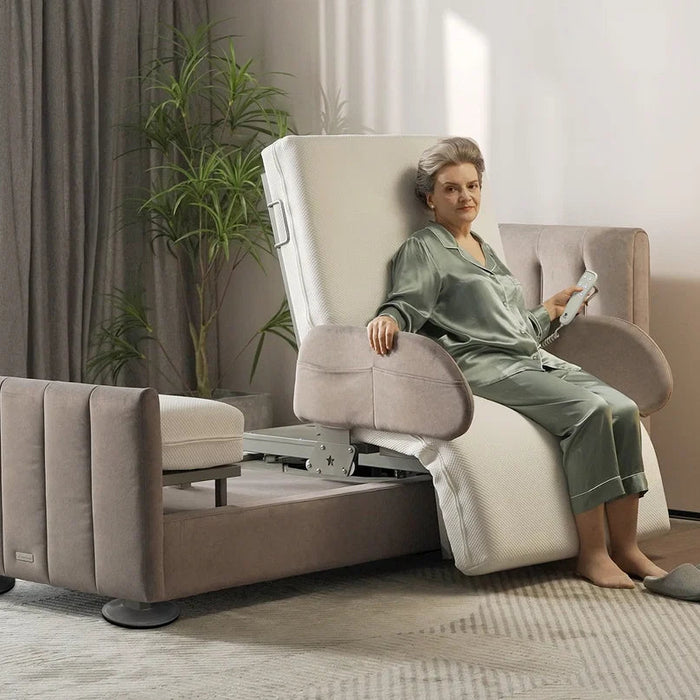 A woman in a green robe sits in a beige and white electric Starsleep Orin arlo rotating chair bed with a footrest, in a modern living room setting.
