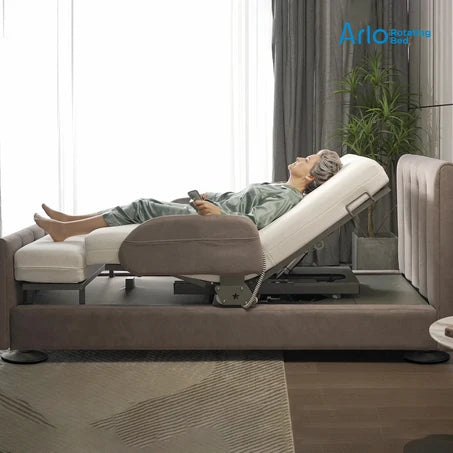 Starsleep Orin Arlo ergonomic rotating chair bed recliner in a modern living room setting, shown with a person lying down on the adjustable cushioned surface.