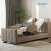 A woman reclines on a Starsleep Orin Arlo ergonomic rotating chair bed with a padded taupe upholstered frame and white mattress, shown in a softly lit bedroom setting with curtains, a plant, and a patterned rug. The Arlo Rotating Bed logo appears in the top right.