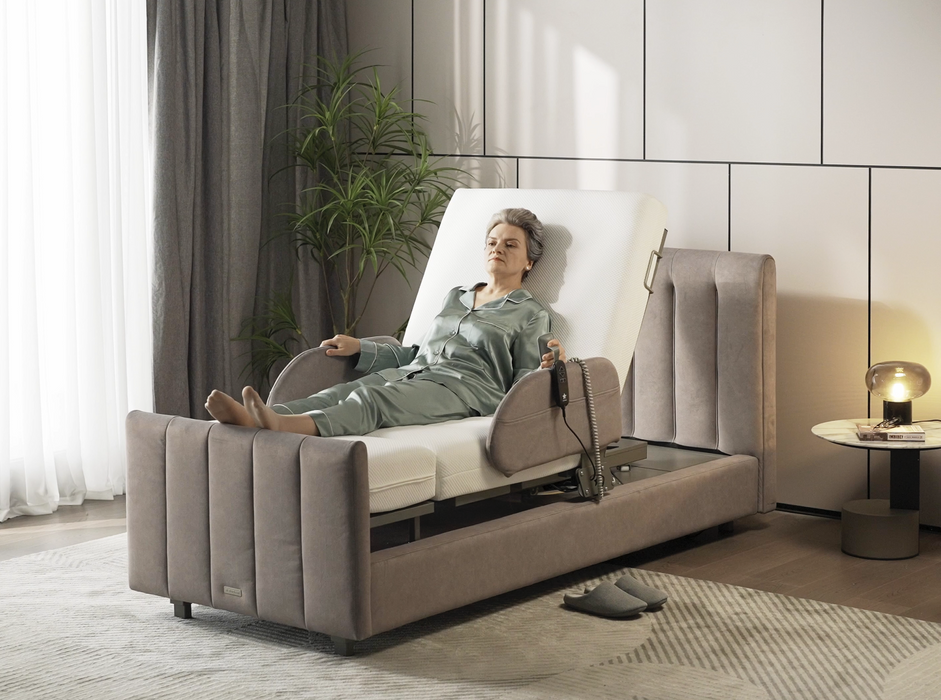 StarSleep Orin Smart Rotating Bed With Patient In Elevated Seated Position Holding Hand Pendant View