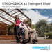 Strongback Mobility Excursion Transport Wheelchair In Use With An Attendant