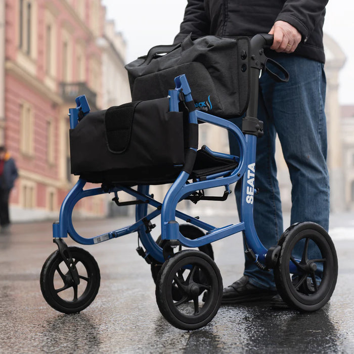 Strongback Mobility Seata Rollator Lightweight, Comfortable, and Ergonomic Being Used Outdoors on a Paved Street