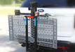 Wheelchair Carrier Mini Electric Lift Installed Into Car Hitch Receiver Folded Side View