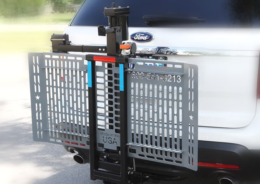Wheelchair Carrier Mini Electric Lift Installed Into Car Hitch Receiver Folded Side View