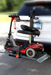 Wheelchair Carrier Mini Electric Lift Installed Into Car Hitch Receiver With Scooter Loaded View