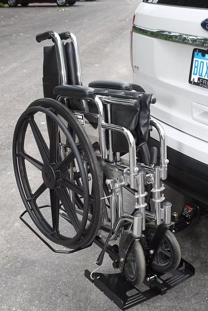Wheelchair Carrier Tote Installed In Car Hitch Receiver With Folded Wheelchair Side View