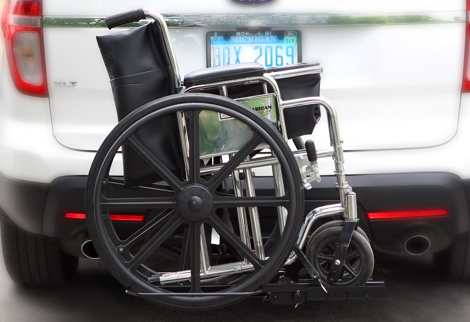 Wheelchair Carrier Tote Installed In Car Hitch Receiver With Folded Wheelchair View