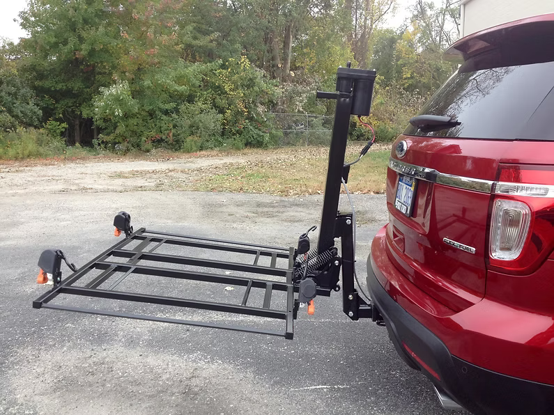 Wheelchair Carrier XL4 Electric Lift Installed Into Car Hitch Receiver Folded Side View