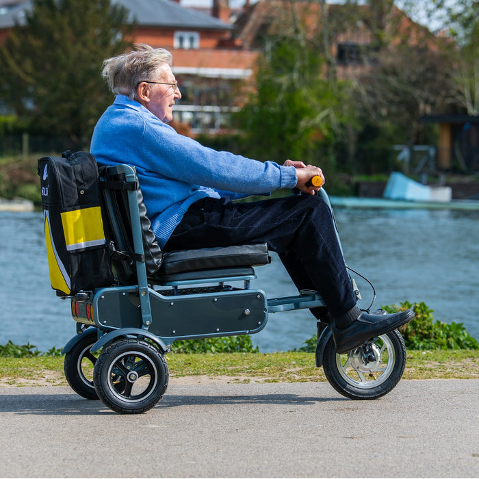 eFoldi Explorer Ultra Lightweight Scooter Side View With Rider